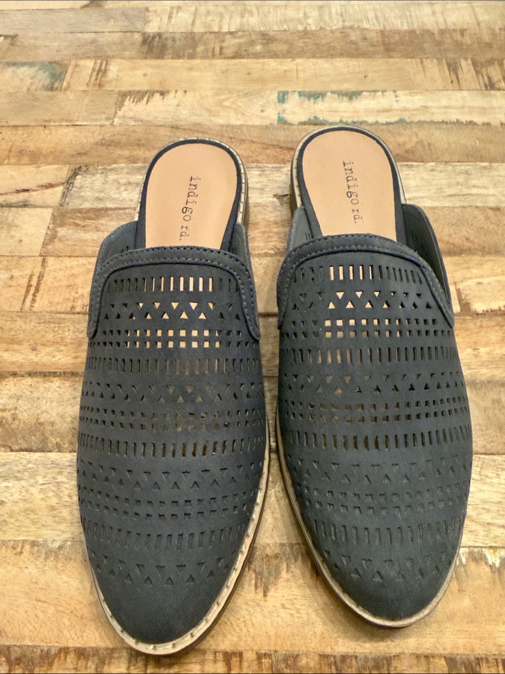 Indigo perforated backless mules in navy